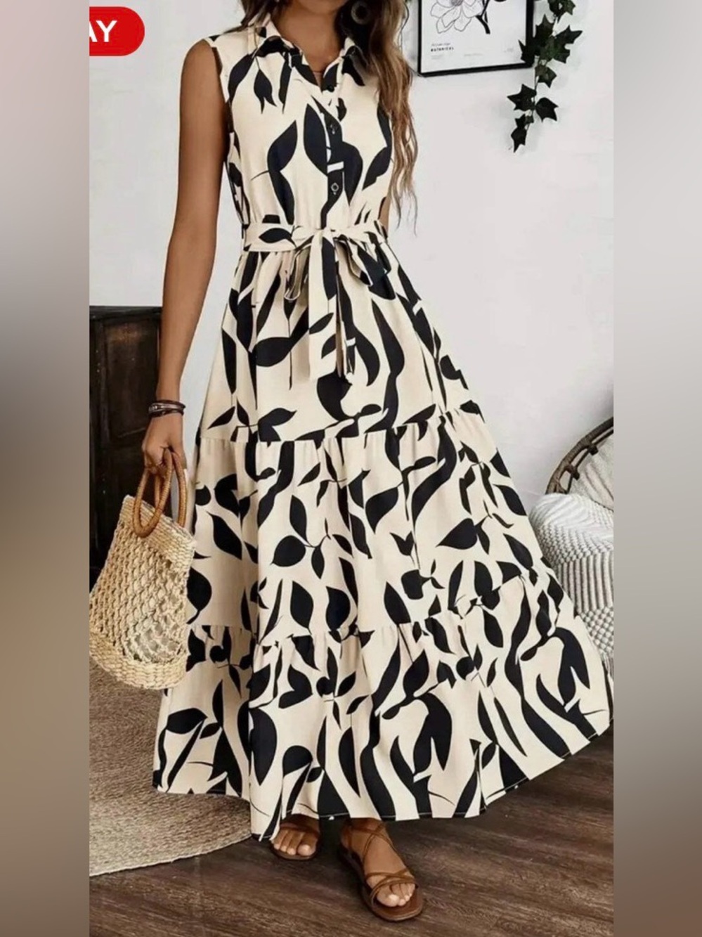 Sleeveless black and cream patterned dress with collar